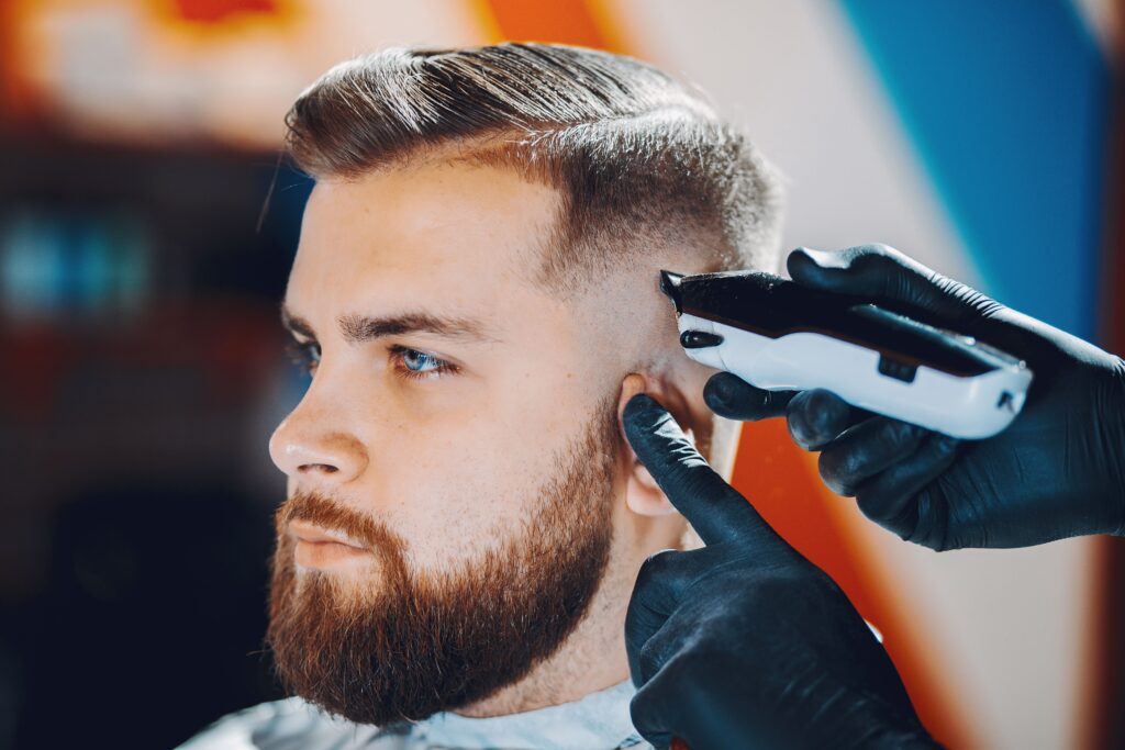Man getting a precise haircut with clippers at a professional Larnaca barber shop