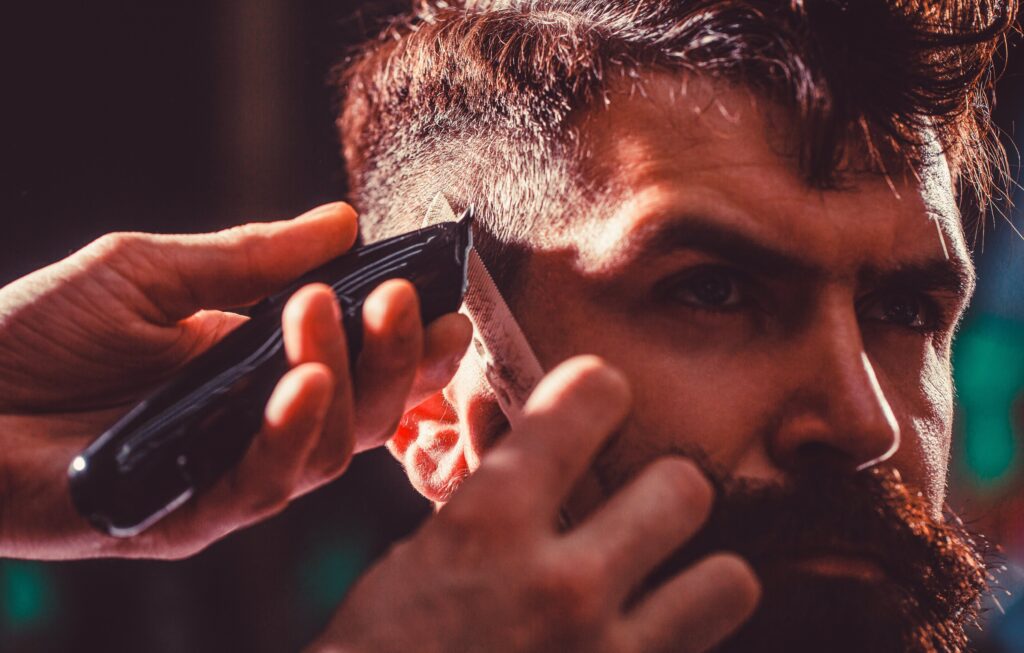 Close-up of a precise neck fade haircut with clippers, offering the best barber experience in Larnaca.